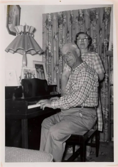 John and Livia Briozo at a piano