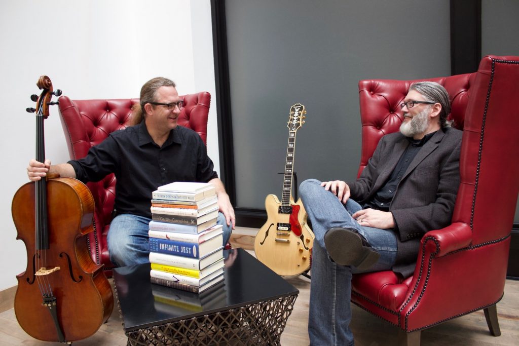 Aaron Kerr and Tyson Allison sitting in room