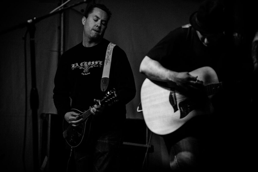 Mike Nordby playing mandolin with Swallows